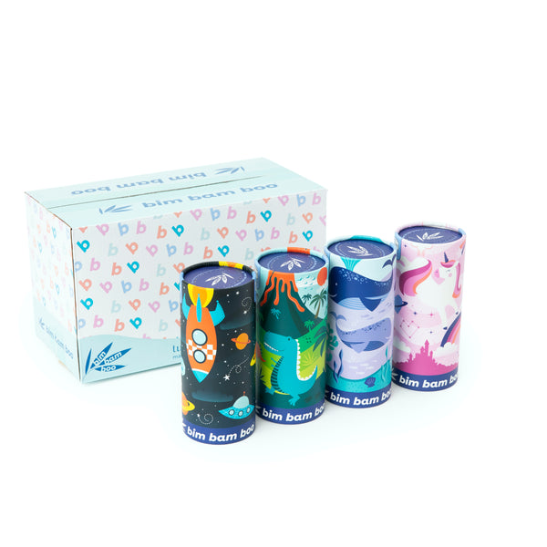 Set of four colorful cylindrical containers with a printed box in the background