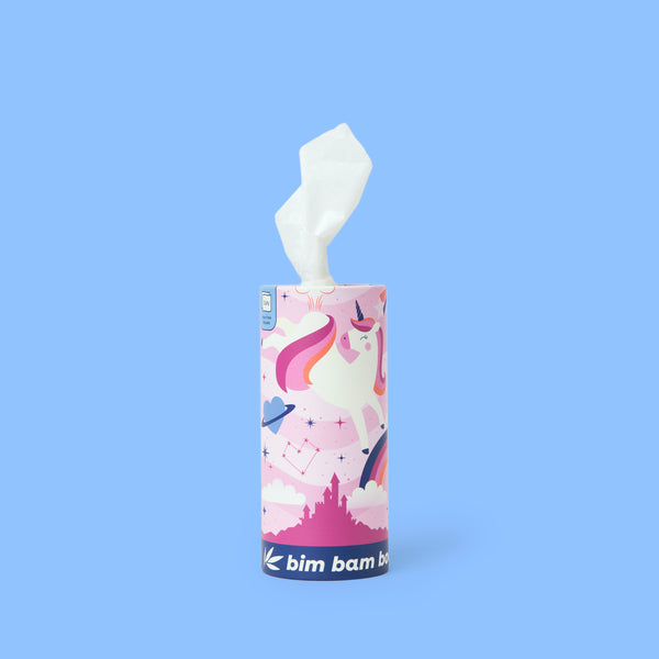 Cylindrical tissue box with a colorful unicorn-themed design on blue background