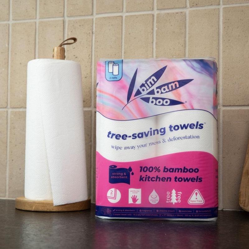 Bamboo kitchen towels on a countertop with wooden cutting board