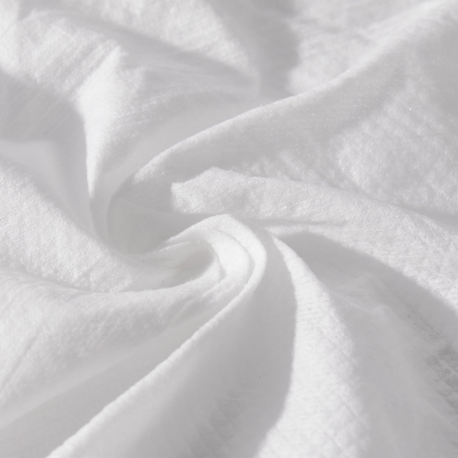 Close-up of white flushable wet wipe with a textured surface