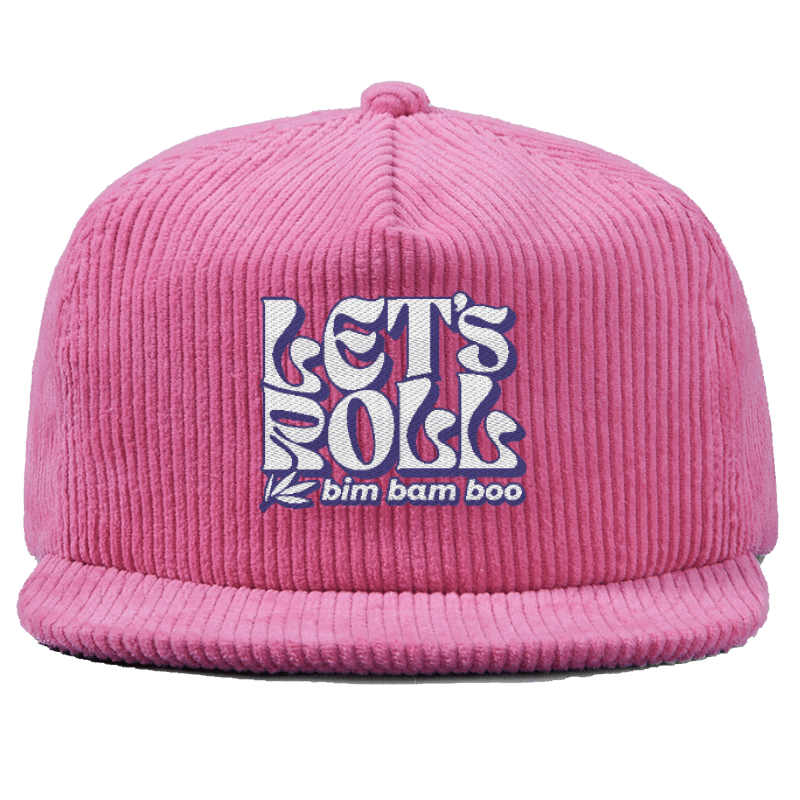 Close up of a pink corduroy baseball hat with the words "Let's Roll" in a wavy font embroidered on it.